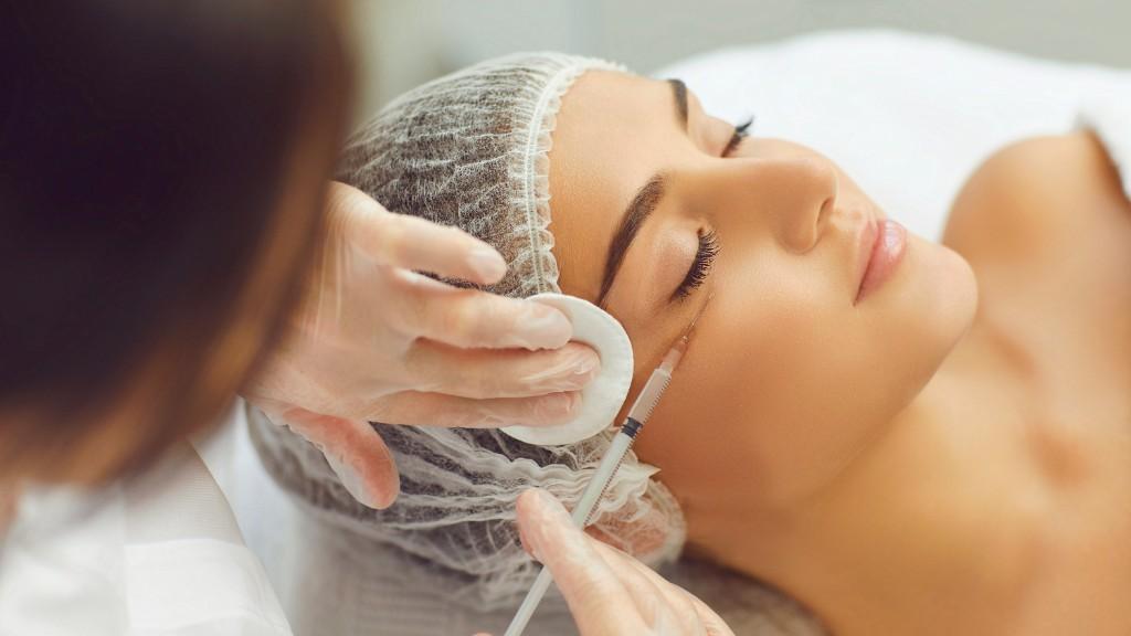 Botox treatment close-up with syringe procedure
